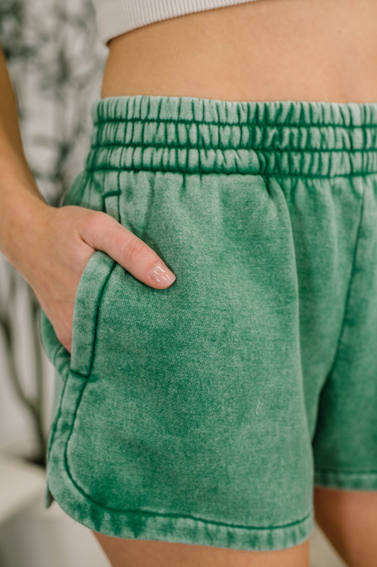 Zenana Acid Wash Elastic Waistband Dolphin Hem Shorts in Forest Green