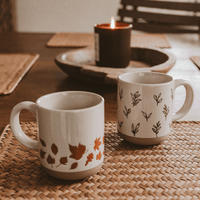 Sweet Water Decor Orange Leaves 14 oz Cream Stoneware Coffee Mug